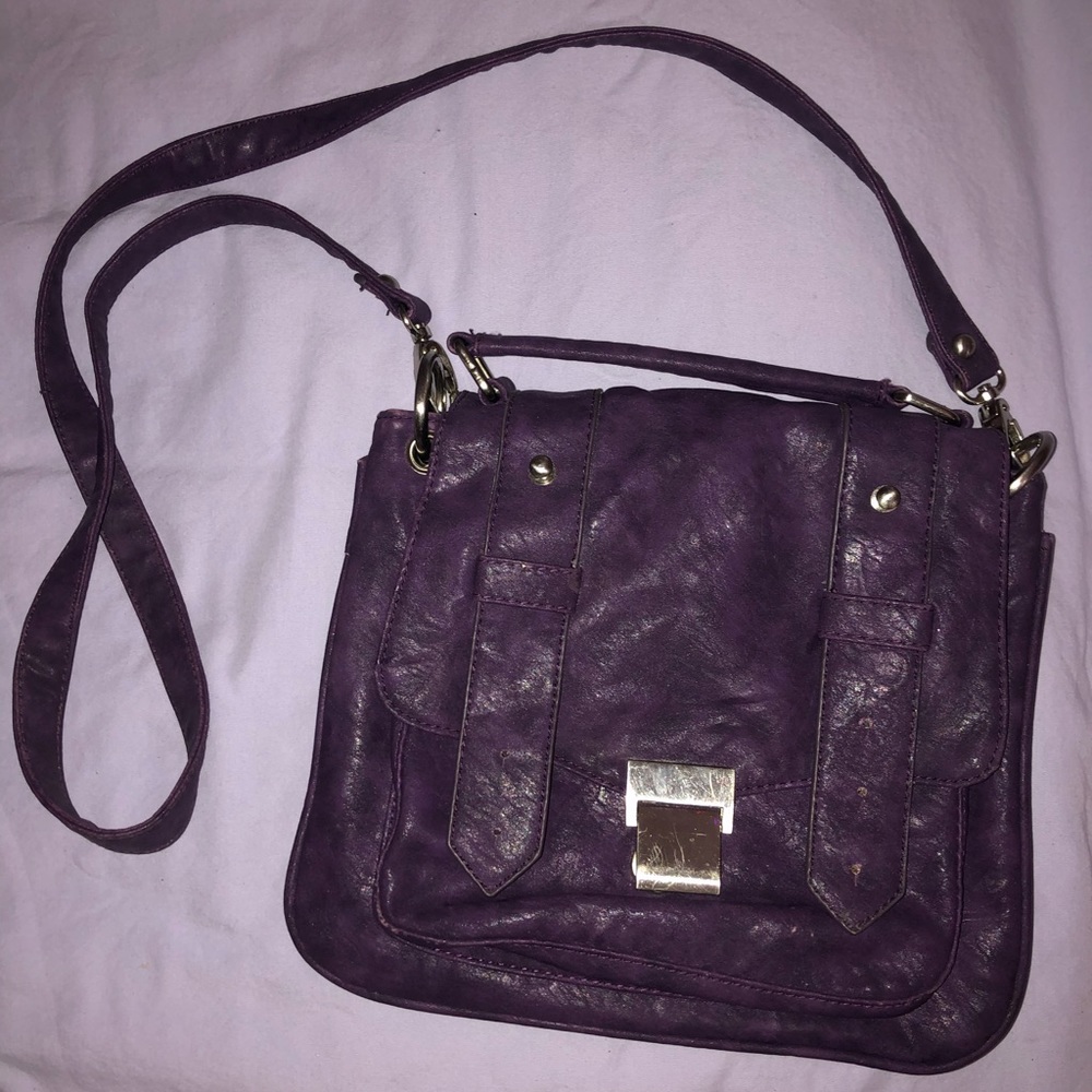 Purple cross body faux leather purse with silver metal finishes
